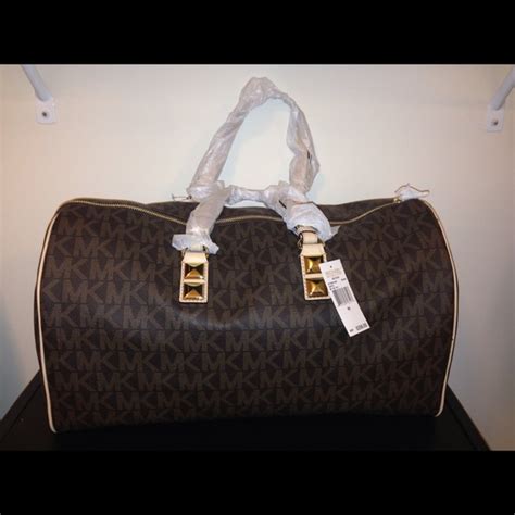 mk duffle bag fake|michael kors large duffle bag.